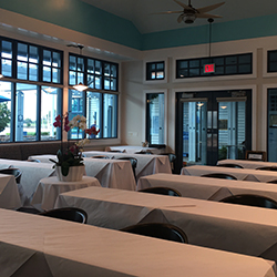 Tables setup in the confrence room for a meeting.