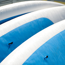 Windsurfing boards all lined up.