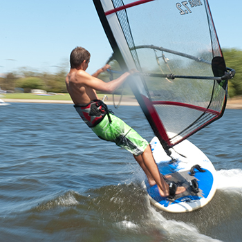 A person windsurfing really fast.