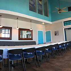 An empty table setup in the meeting room for guests